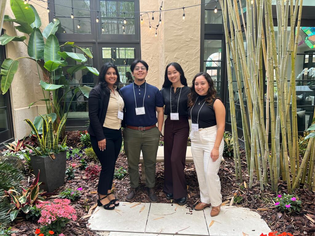 group image of Rhodes College students at a conference