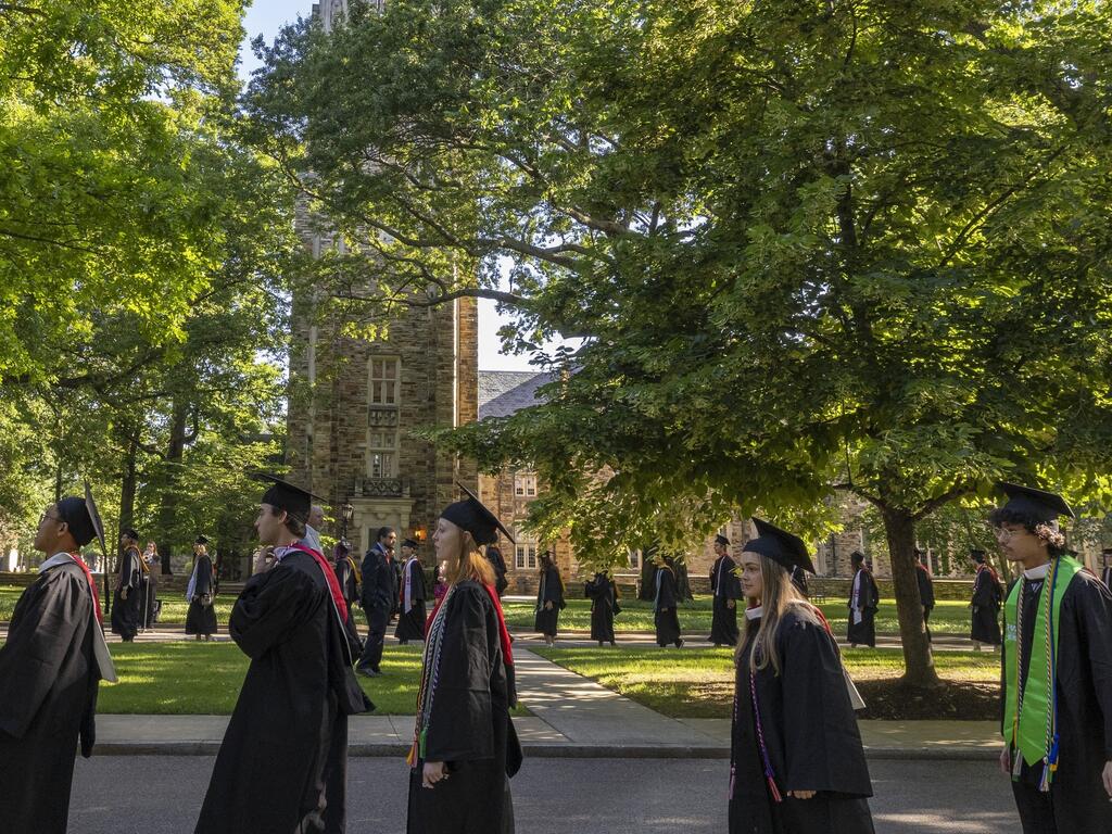 image of graduates walking on Rhodes College campus