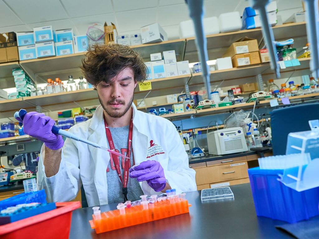 image of a Rhodes student working in a science lab