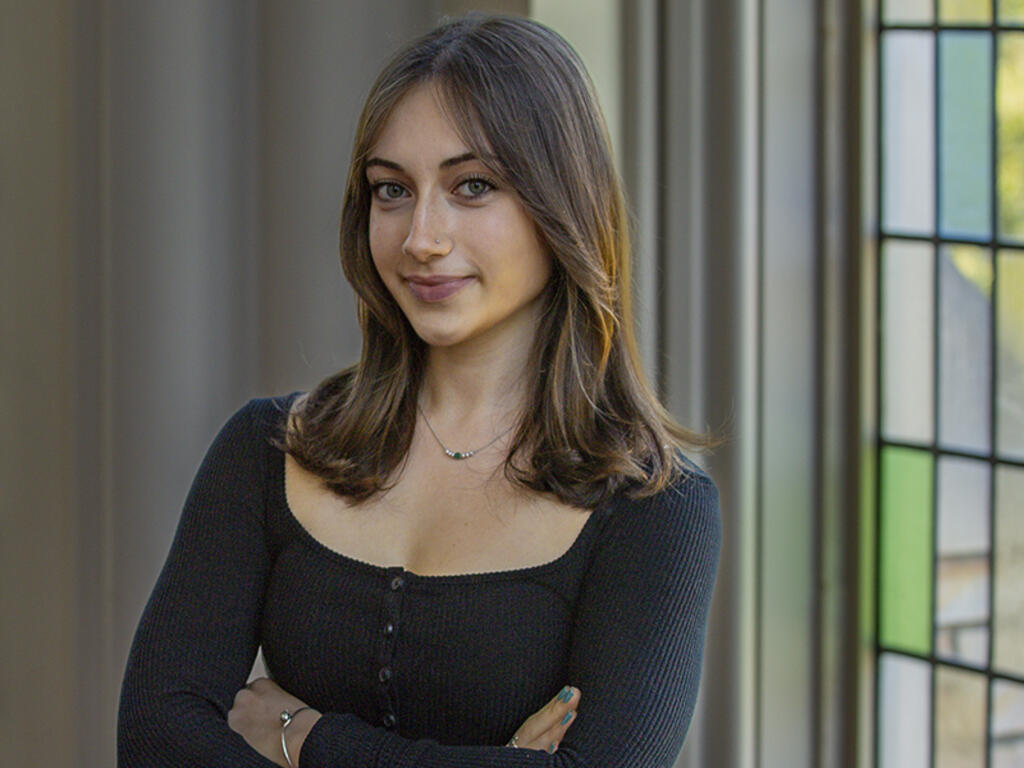 a young woman with shoulder-length brown hair