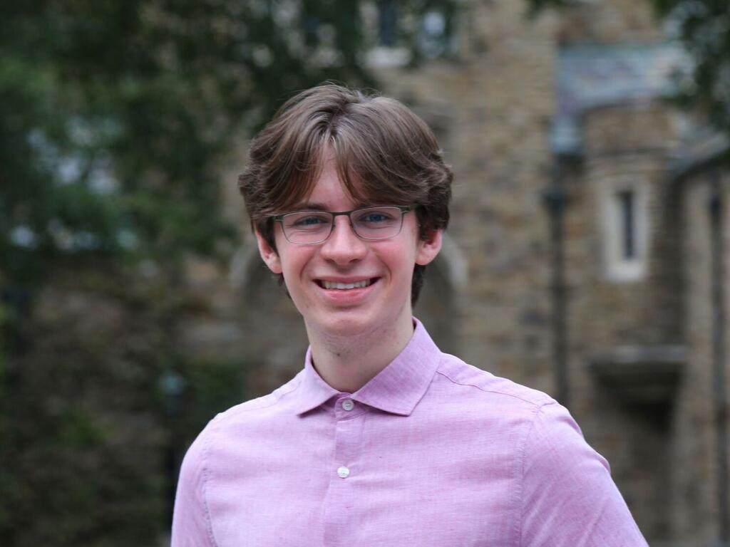 image of Hugh Ferguson standing outside on Rhodes campus