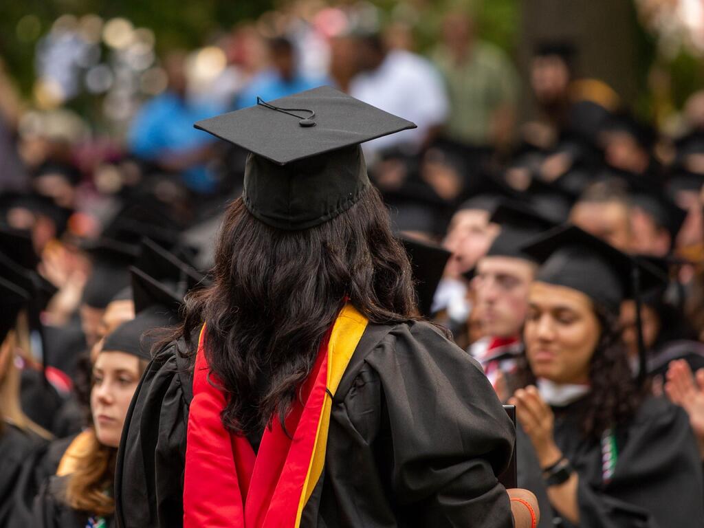 image of a Rhodes College graduate in the audience