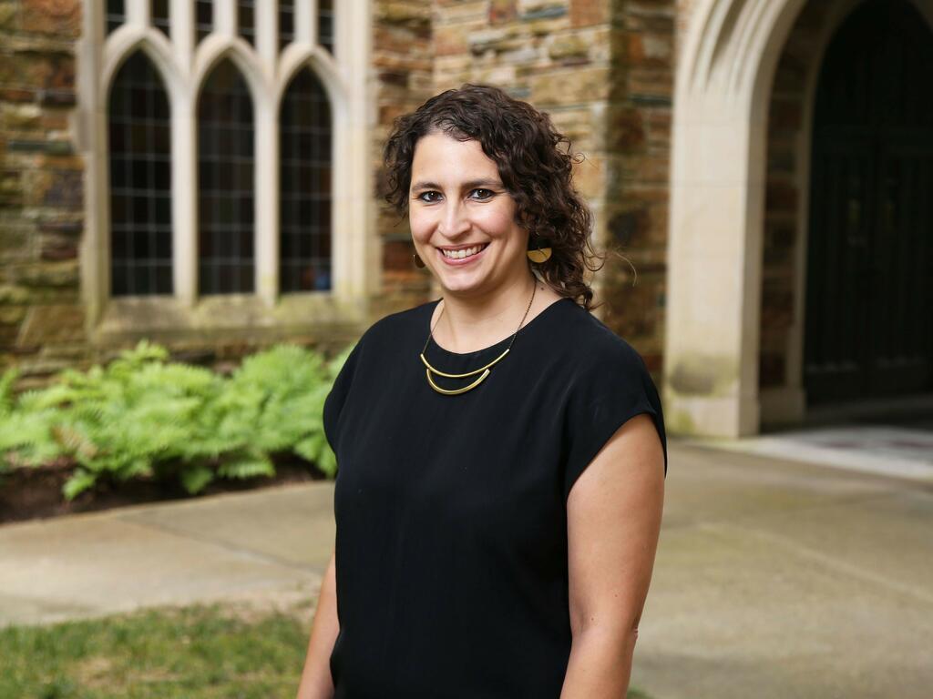 Sarah Ifft Decker standing outside on Rhodes College campus