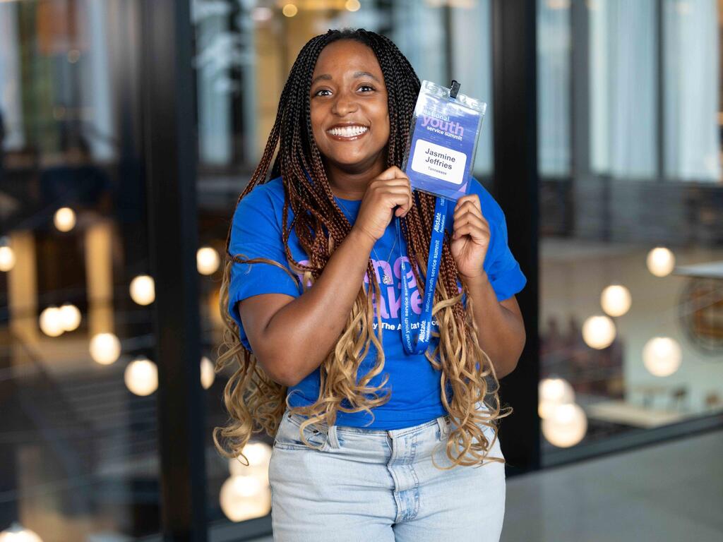 image of Jasmine Jeffries holding her meeting badge