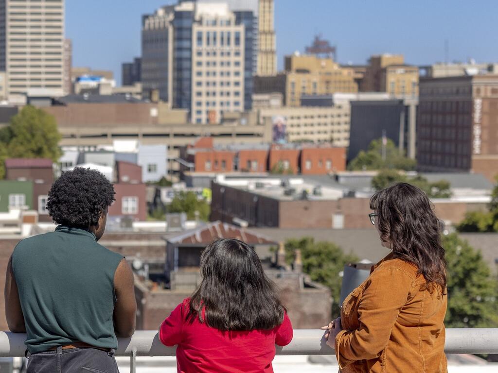 image of Rhodes College students looking out at Downtown Memphis