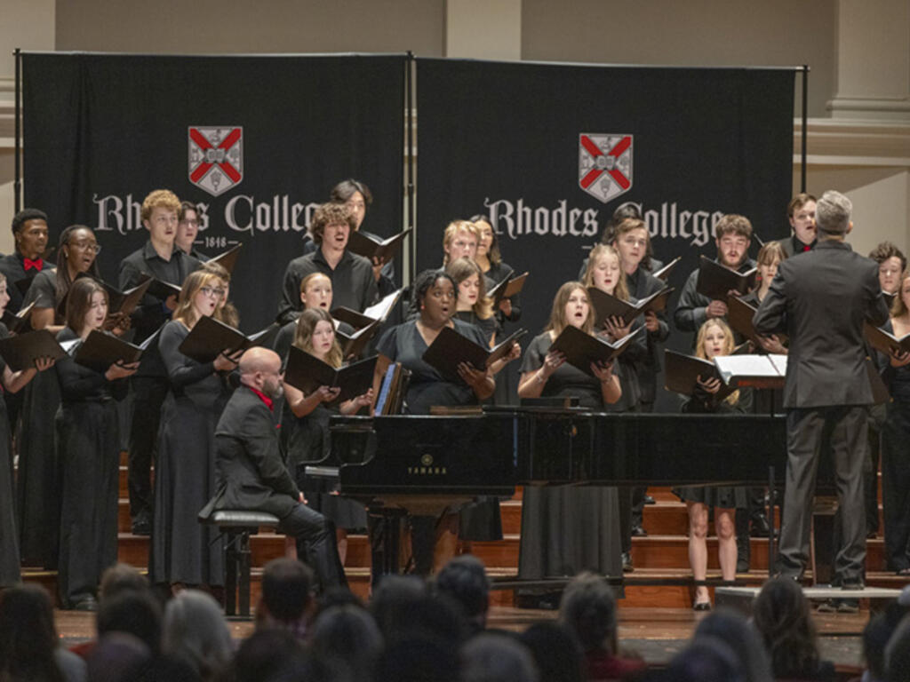 a group of singers led by a conductor
