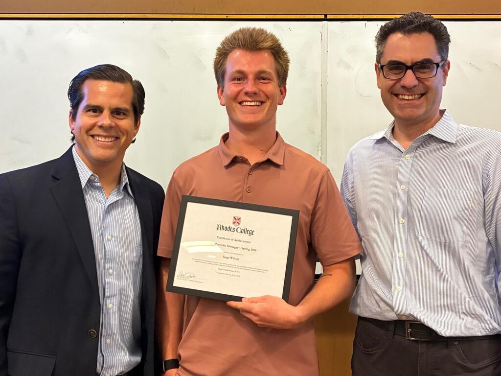 group image of business student, holding certificate, and two faculty members
