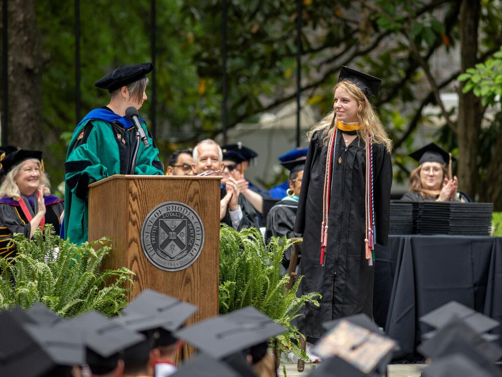 image of GraceAnne Hodgson on stage receiving award