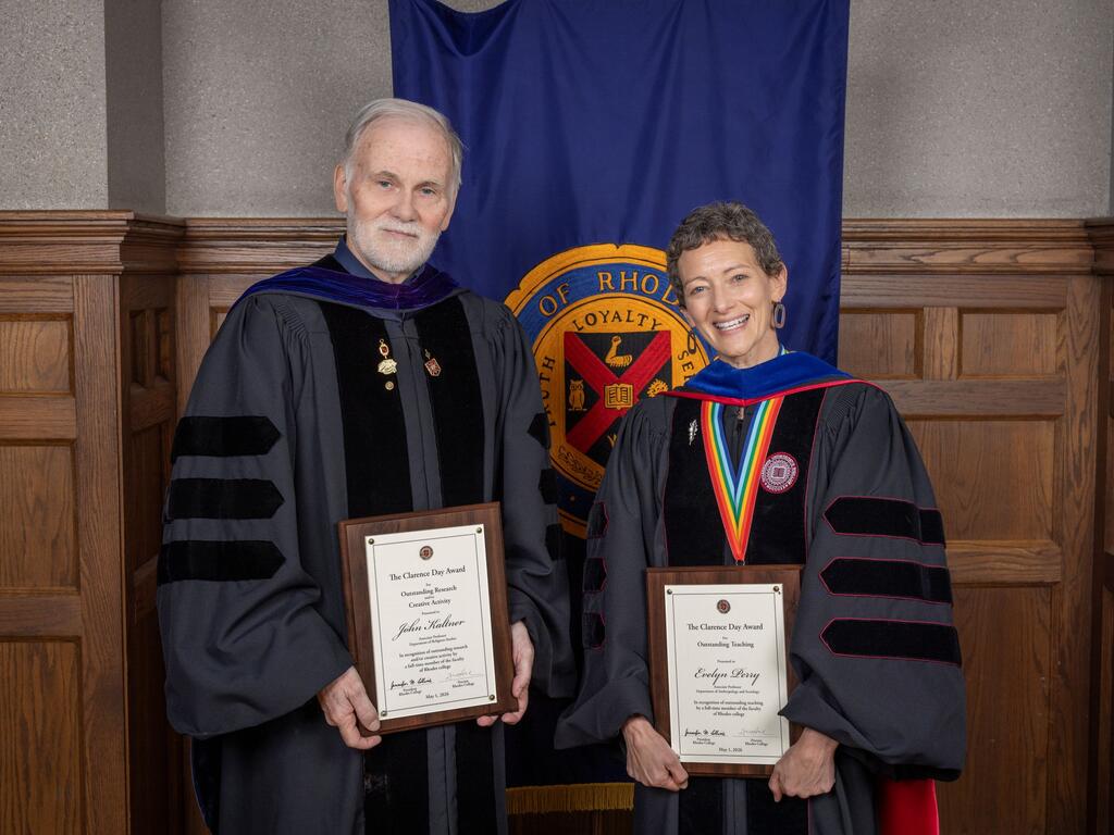 image of Profs. John Kaltner and Evelyn Perry holding plaques
