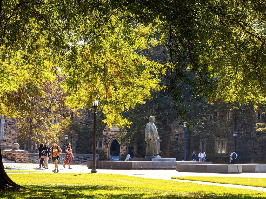 students walking on Rhodes College campus