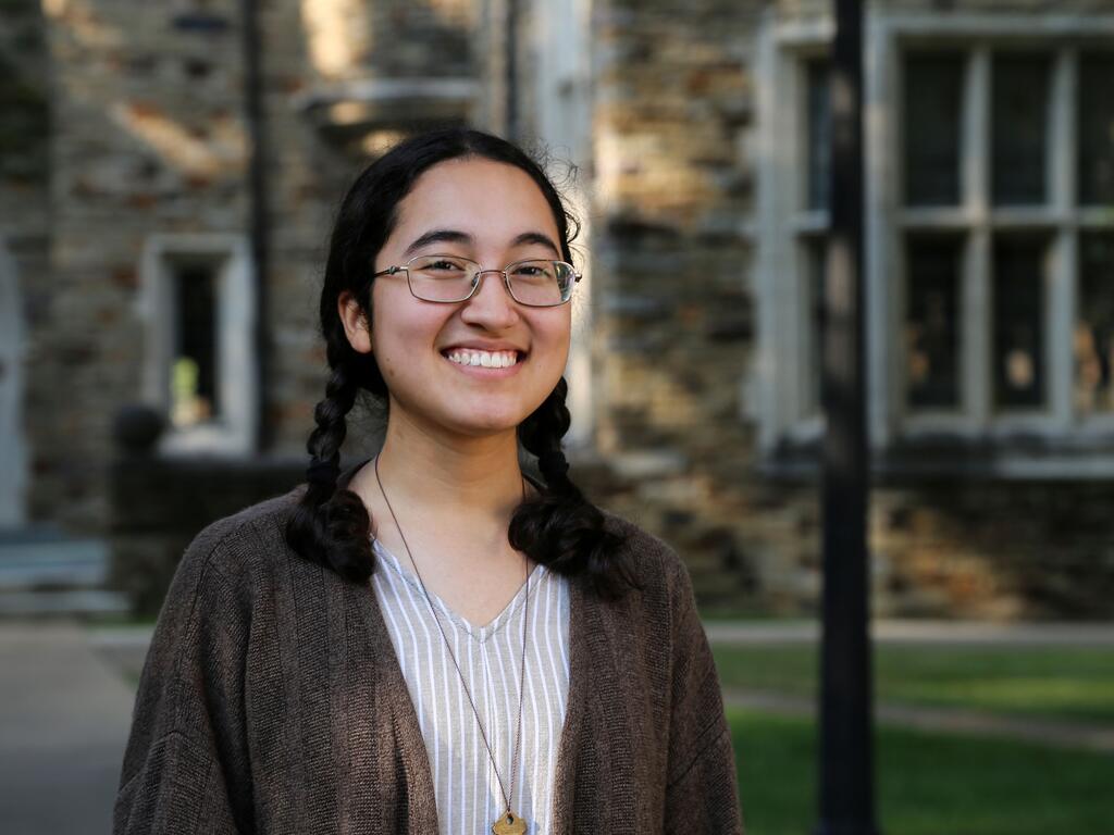 Yasmine Pirlepesova standing outside on Rhodes College campus