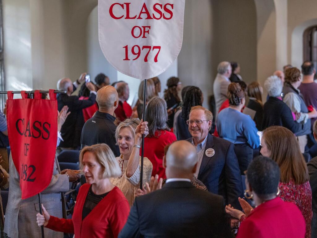 image of alumni holding class banners