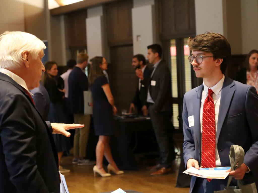 image of Rhodes College students networking at Meet the Firms event