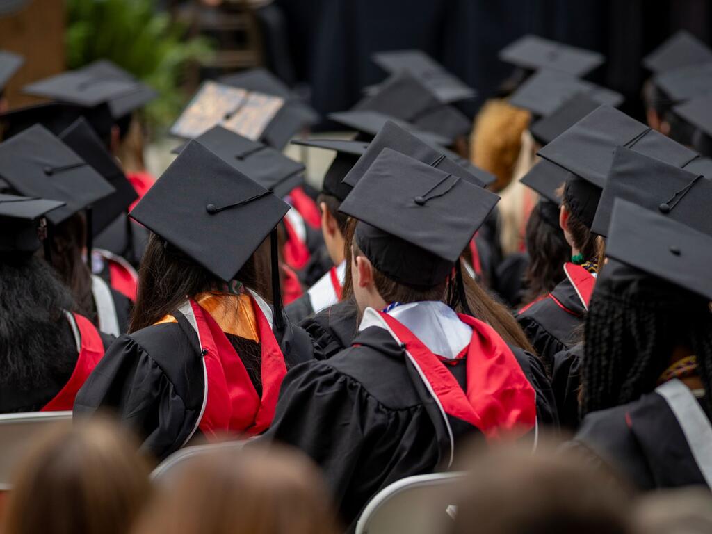 image of Rhodes College graduates in the audience 