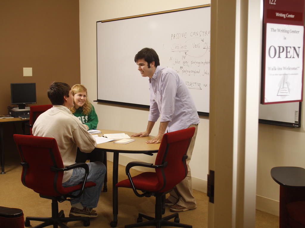 students talk in a classroom