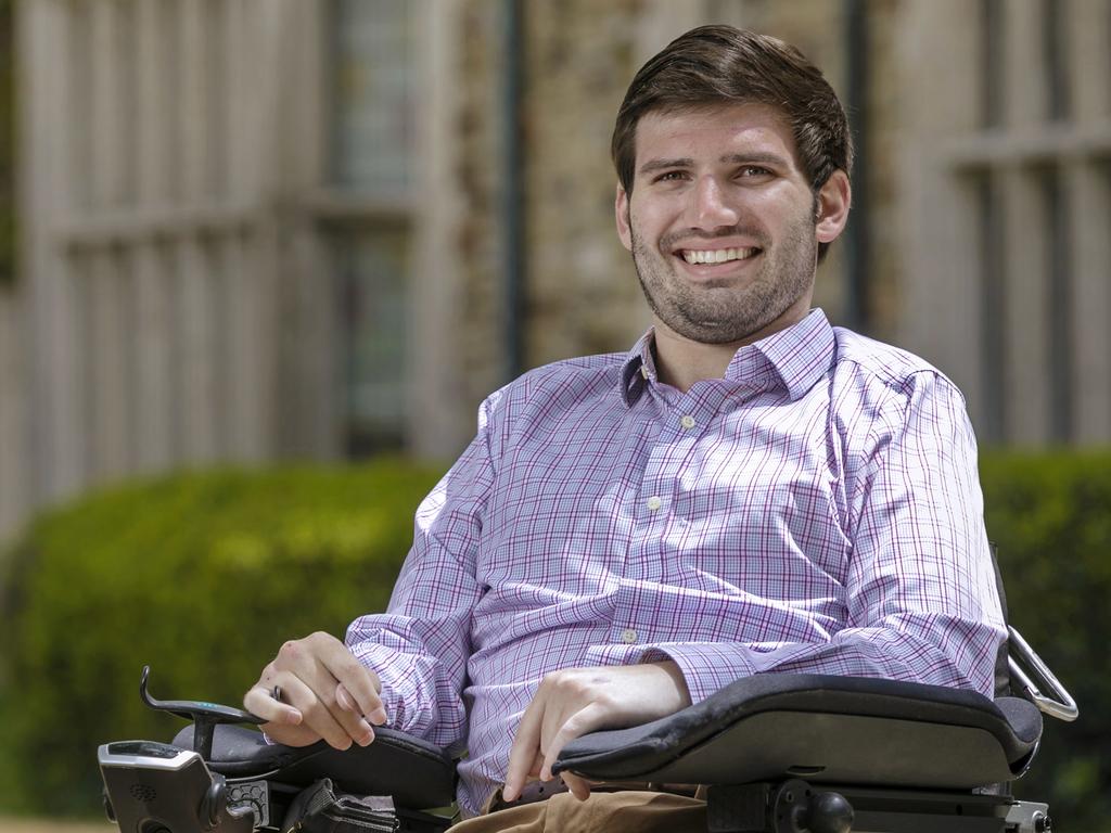 college-aged male sitting in a wheel chair