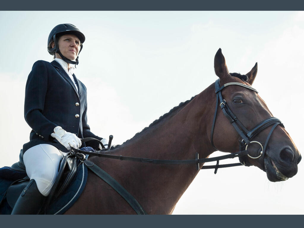 a white woman on a horse